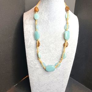 Necklace, with light blue stones/leather tied .